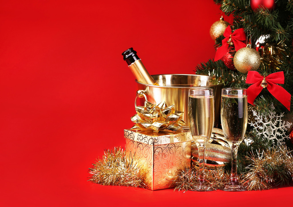 Christmas or New Year's Eve. Champagne and Presents over Red - Photo, Image