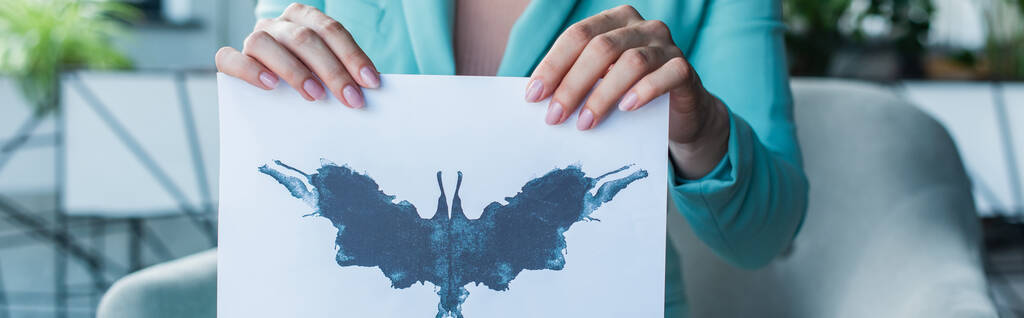 Cropped view of psychologist holding Rorschach test in consulting room, banner  - Φωτογραφία, εικόνα