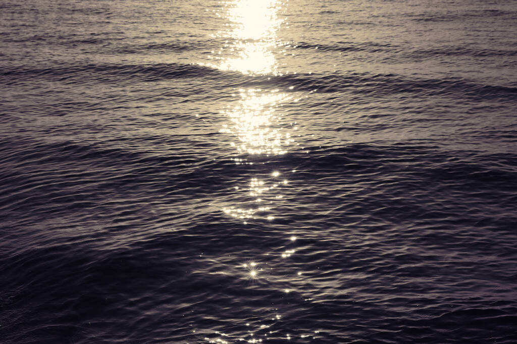 Rippled surface of sea at sunset as background - Photo, Image