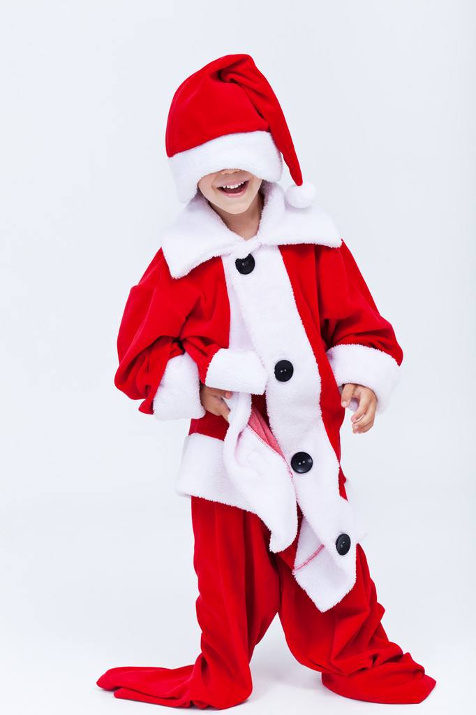 Щасливий помічник Санти приміряє дуже великий різдвяний костюм
 - Фото, зображення