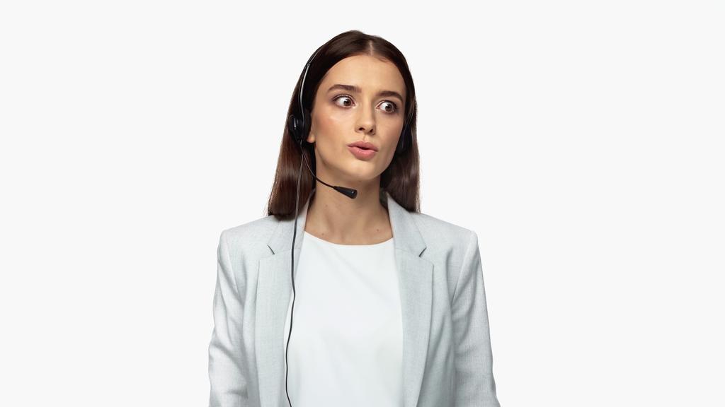 young operator in headset with microphone and grey blazer talking isolated on white - Zdjęcie, obraz