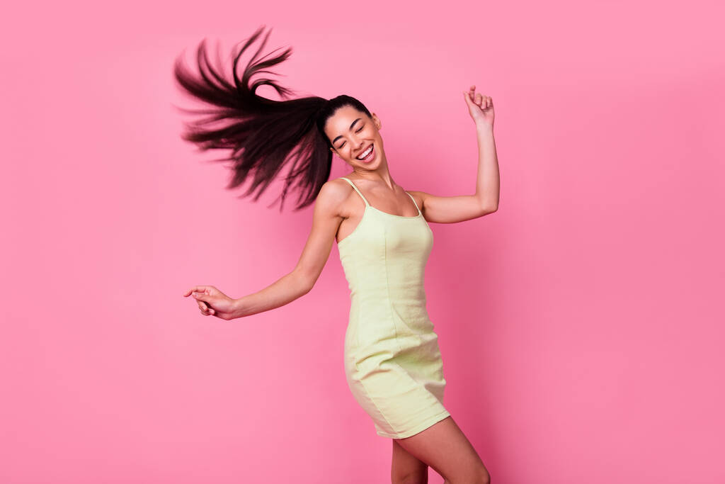 Photo of adorable cute positive lady go crazy on dancing floor wear mini dress isolated on pink color background. - Foto, imagen