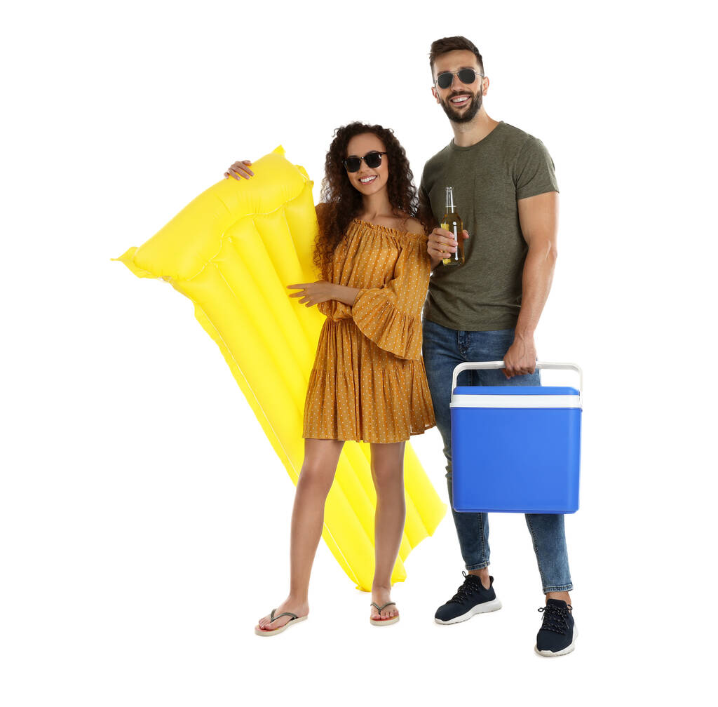 Happy couple with cool box, inflatable mattress and bottle of beer on white background - Photo, Image