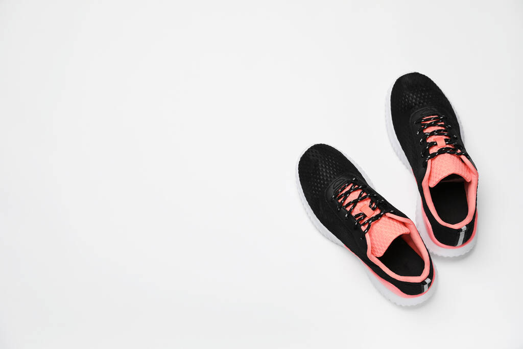 Pair of stylish sport shoes on white background, flat lay. Space for text - Фото, изображение