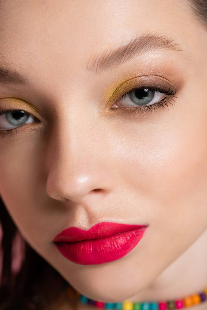 close up of young model with bright makeup looking at camera - Foto, Imagen