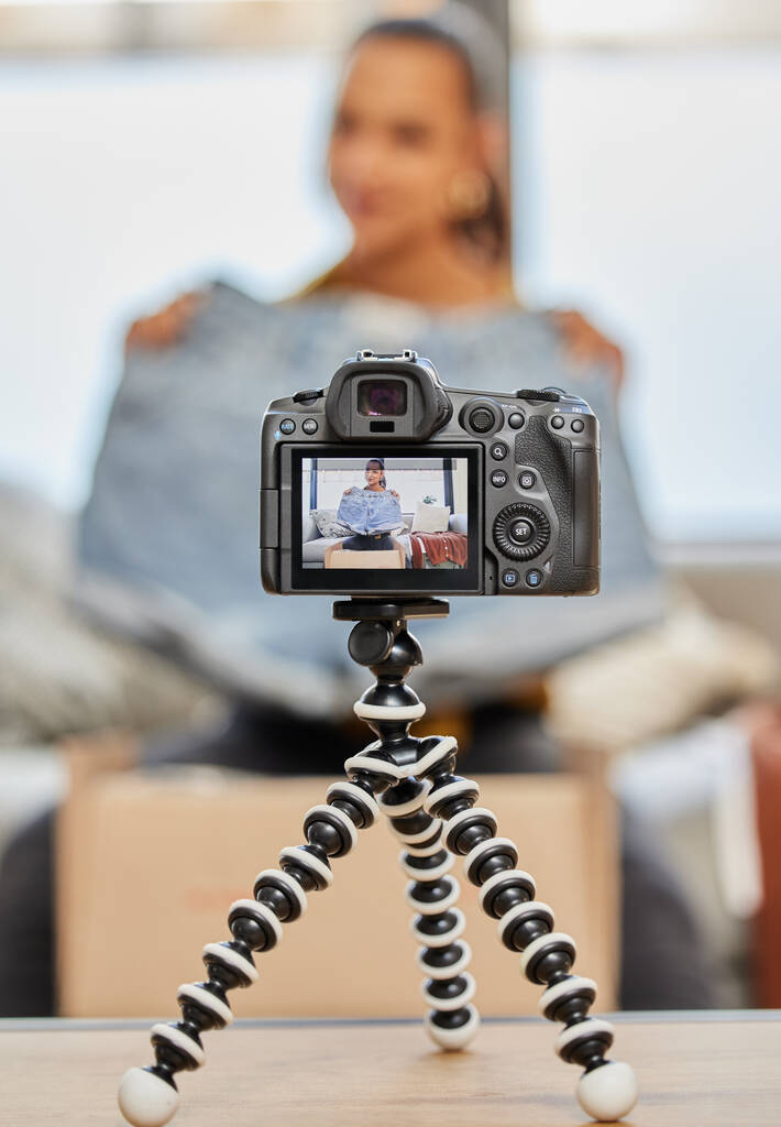 Today were talking about summer must-haves. a young woman recording a video for her vlog at home - Fotó, kép