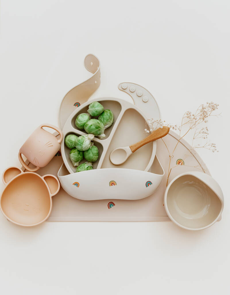 Fresh Brussels sprouts on a light background. Concept of healthy eating and first feeding of children, baby food additives, allergies. Top view, flat lay - Zdjęcie, obraz
