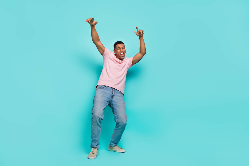 Full length photo of attractive sweet guy wear pink t-shirt dancing smiling isolated teal color background. - Φωτογραφία, εικόνα
