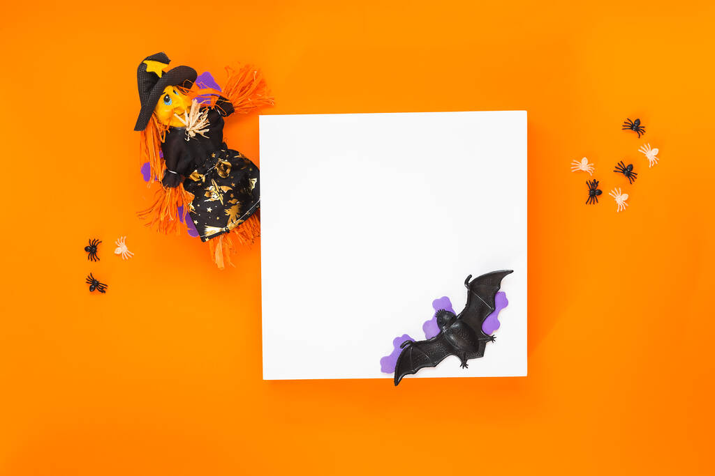 Happy Halloween background.  Background with white podium for product presentation and ornaments on orange background . Minimal concept. Top view, blank space - Fotografie, Obrázek