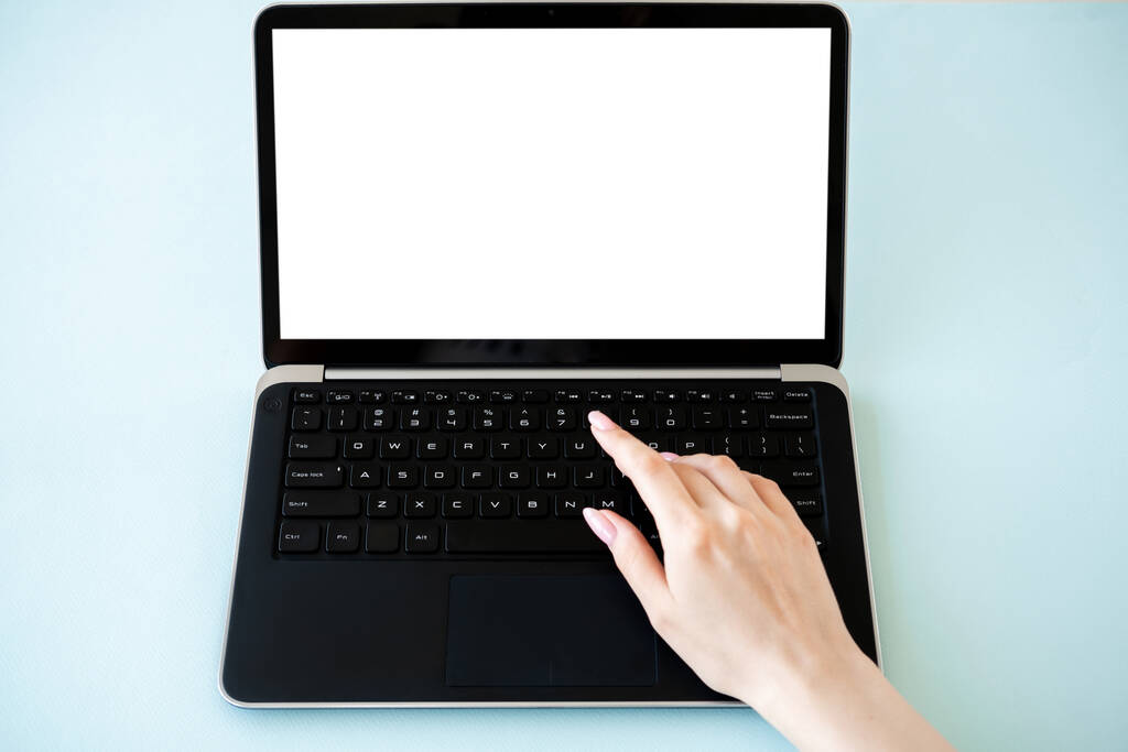 Online education. Digital technology. Advertising mockup. Unrecognizable woman typing laptop with blank screen isolated blue. - Fotografie, Obrázek