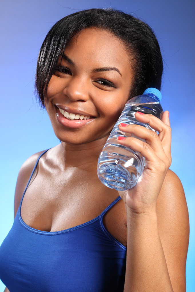 Beautiful healthy black girl with bottled water - Photo, Image