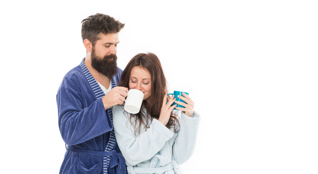 Wife and husband bathrobes hold tea mug coffee cup. Caffeine power concept. With coffee morning tastes better. Couple relax in morning with coffee. Couple enjoy lazy weekend and drink coffee. - Fotografie, Obrázek