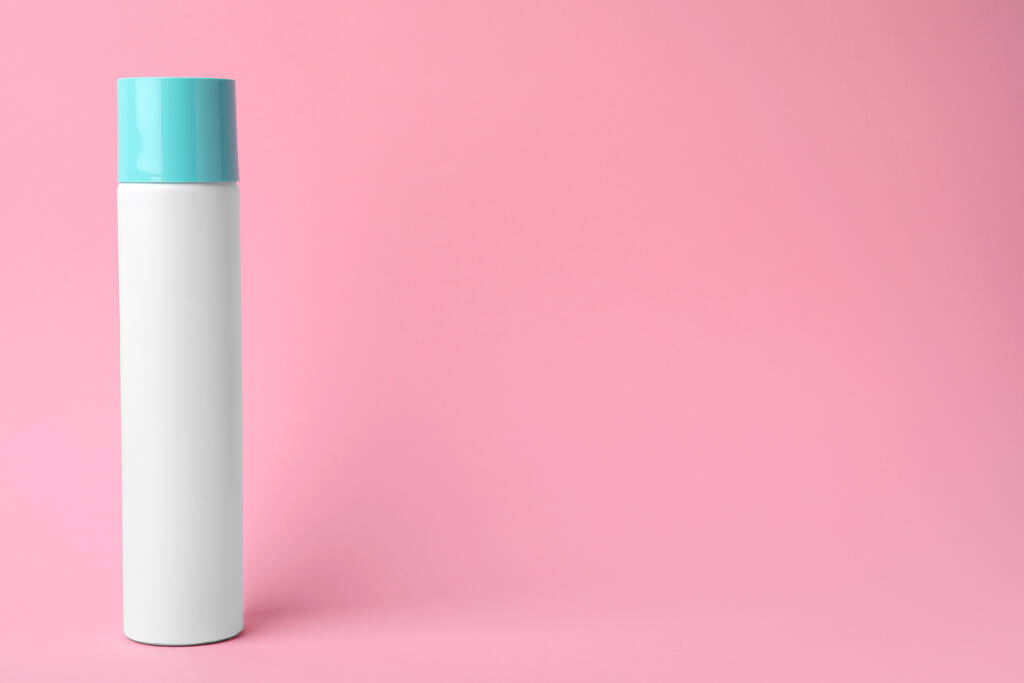 Bottle of dry shampoo on pink background. Space for text - Fotografie, Obrázek