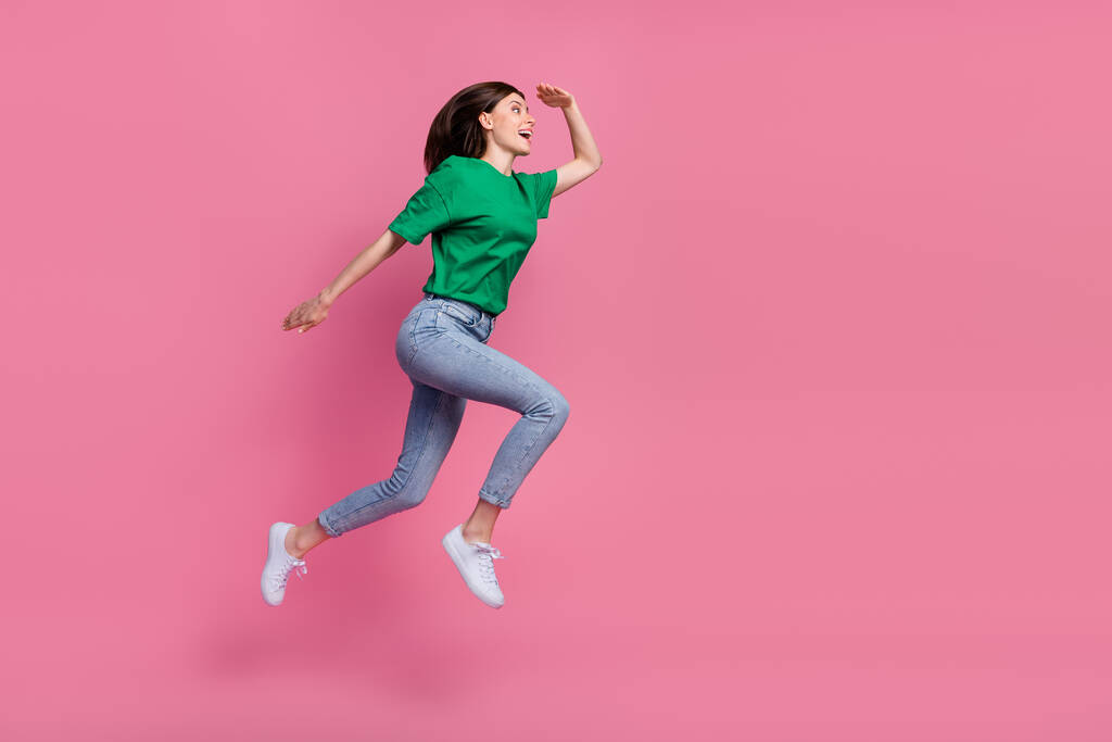 Full body profile portrait of crazy active lady jump run look empty space isolated on pink color background. - Foto, immagini