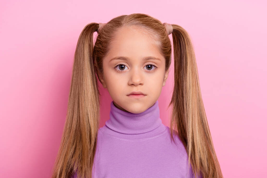 Portrait of young beautiful good looking small lady with two funny ponytails isolated on pink color background. - Foto, immagini