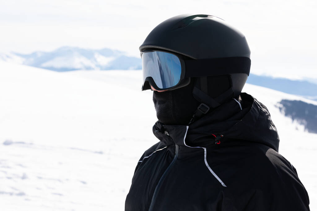 Head shot of man skier  wearing ski helmet and goggles - Valokuva, kuva