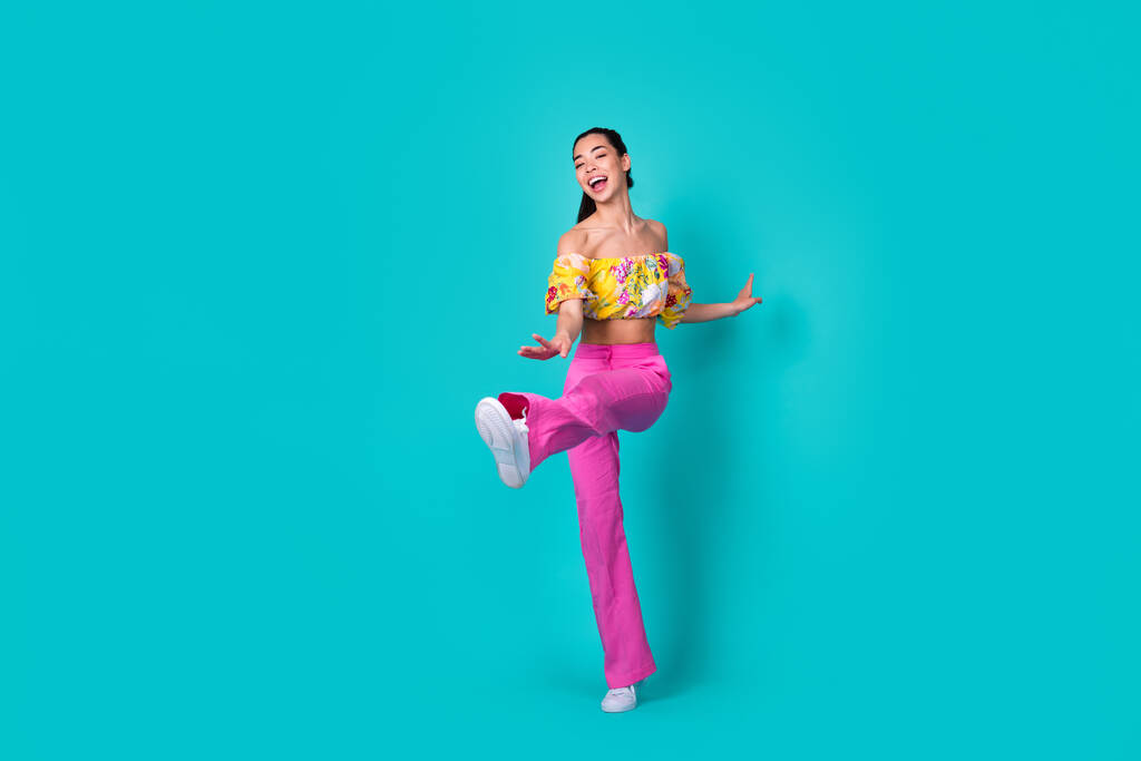 Full body photo of cool young brunette lady dance wear top pants shoes isolated on teal background. - Fotografie, Obrázek