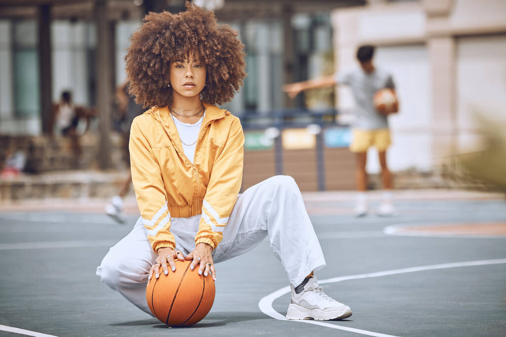 Cool basketball player with funky, confident and hipster attitude ready for game, fun or playing on outdoor sports court. Portrait of young, fashion and beauty black woman with afro ready for fitness. - Photo, Image