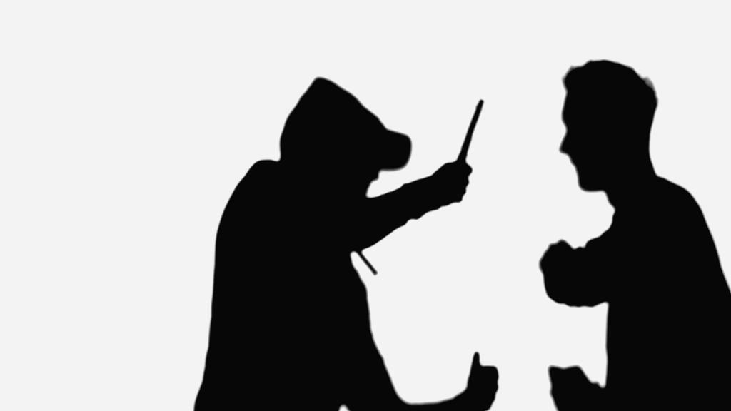 black silhouettes of robber with knife and man with clenched fists isolated on white - Photo, image