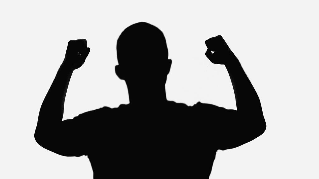 black shadow of man showing win gesture isolated on white - Φωτογραφία, εικόνα