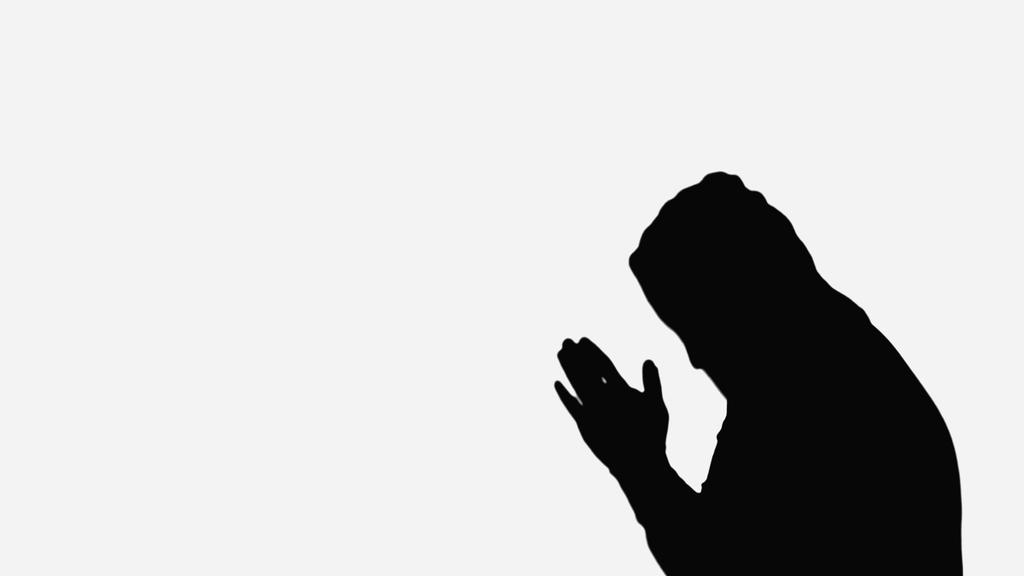 silhouette of monk in hood praying isolated on white - Φωτογραφία, εικόνα