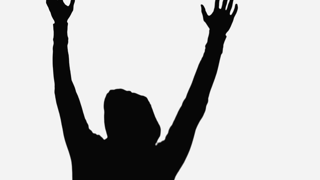 black silhouette of criminal man with hands up isolated on white - Foto, afbeelding