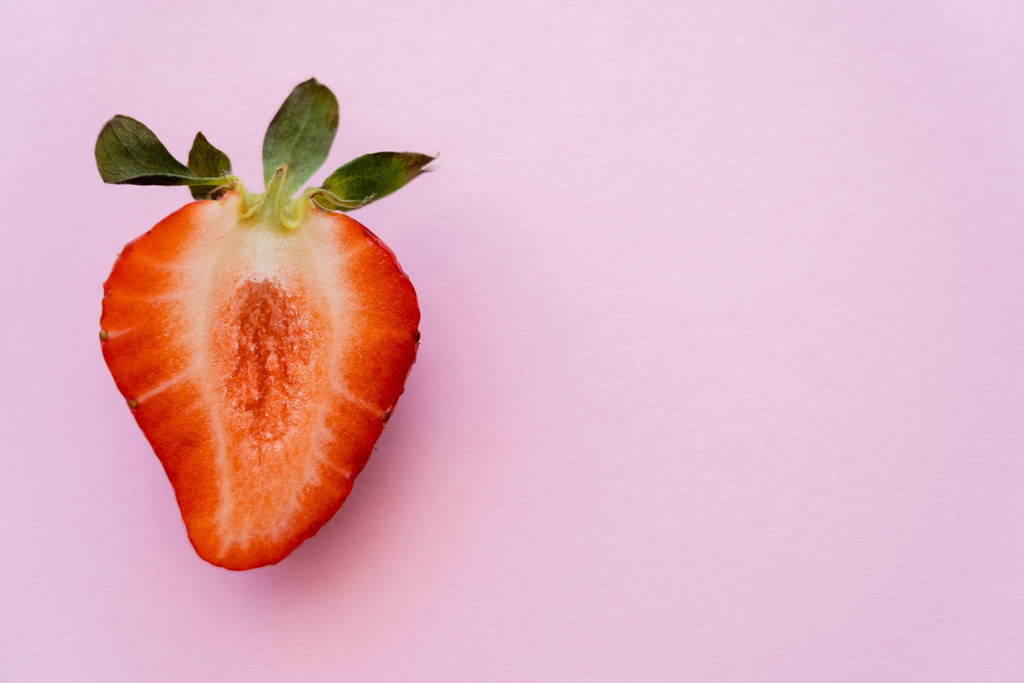 top view of red sliced strawberry isolated on pink with copy space - Photo, Image