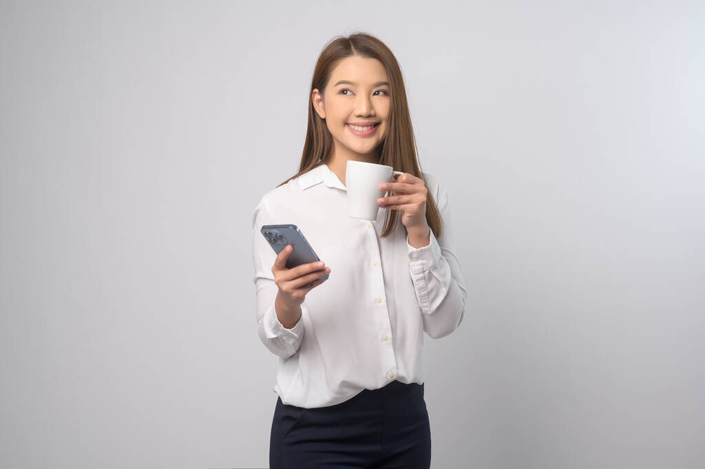A Young asian woman using smartphone over white background, technology concept. 		 - Fotoğraf, Görsel