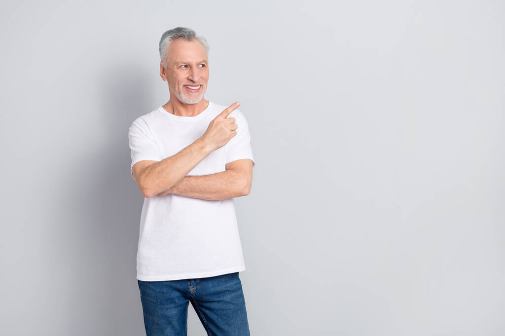 Photo of funny old man look promo wear white t-shirt isolated on grey color background. - Photo, Image