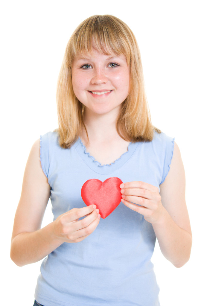 A girl with a heart on a white background. - Photo, Image