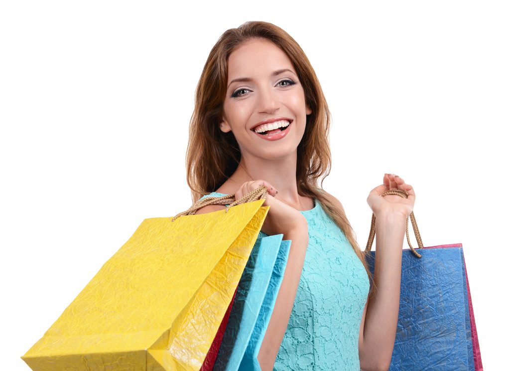 schöne junge Frau mit Einkaufstaschen isoliert auf weiß - Foto, Bild