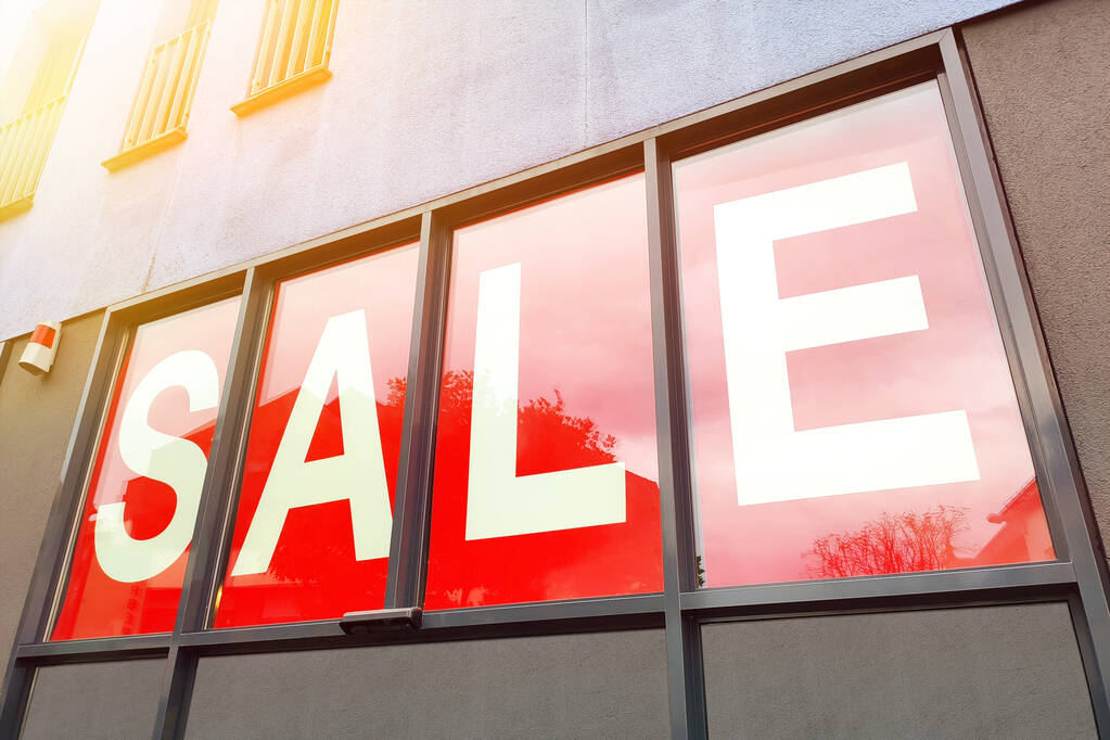 An image of a red sale sign at a shop in germany - Photo, Image