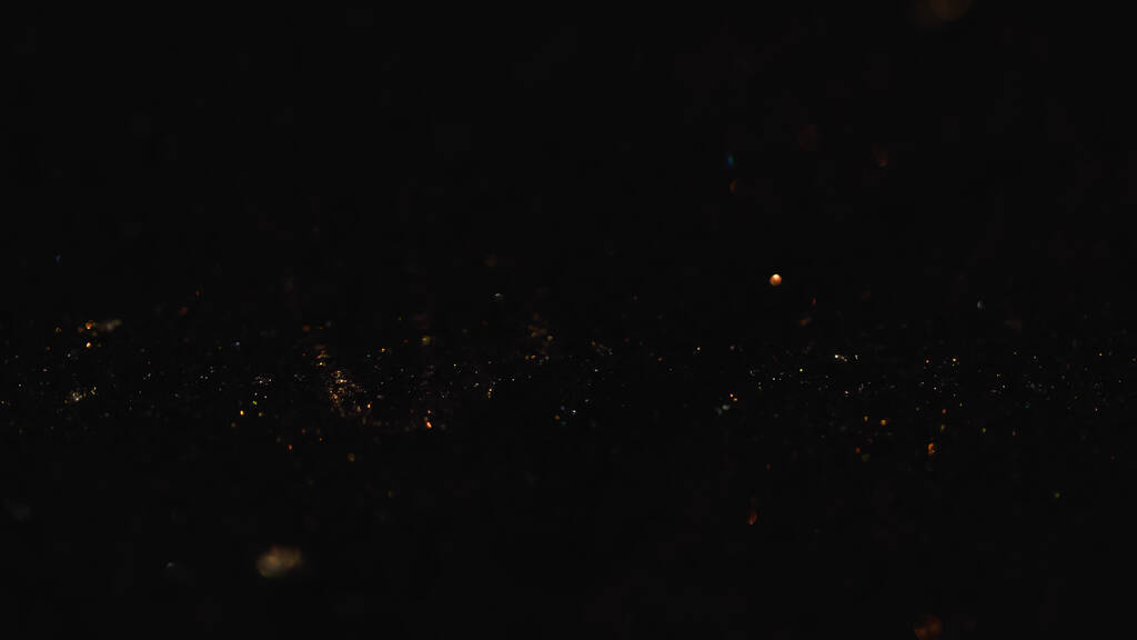 Shiny glitter on black background with copy space  - Photo, Image