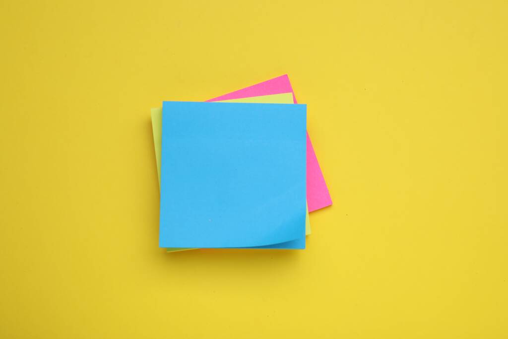 Paper notes on yellow background, top view - Photo, Image