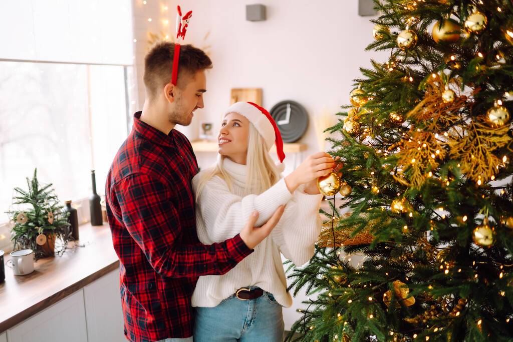 Young couple have Christmas surprise for holiday. Romantic day. Winter holidays. - Photo, Image