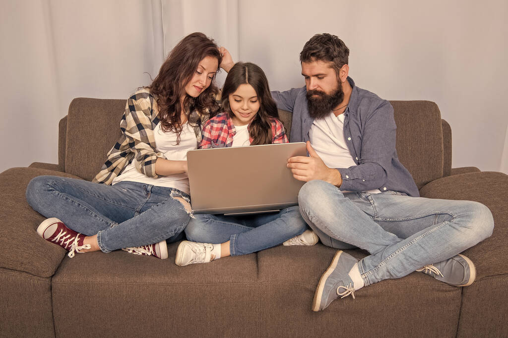 family blog. happy parents with kid girl study online. curious mom dad and daughter shopping on cyber monday. modern education and communication. video call. father mother and child use laptop. - Photo, Image