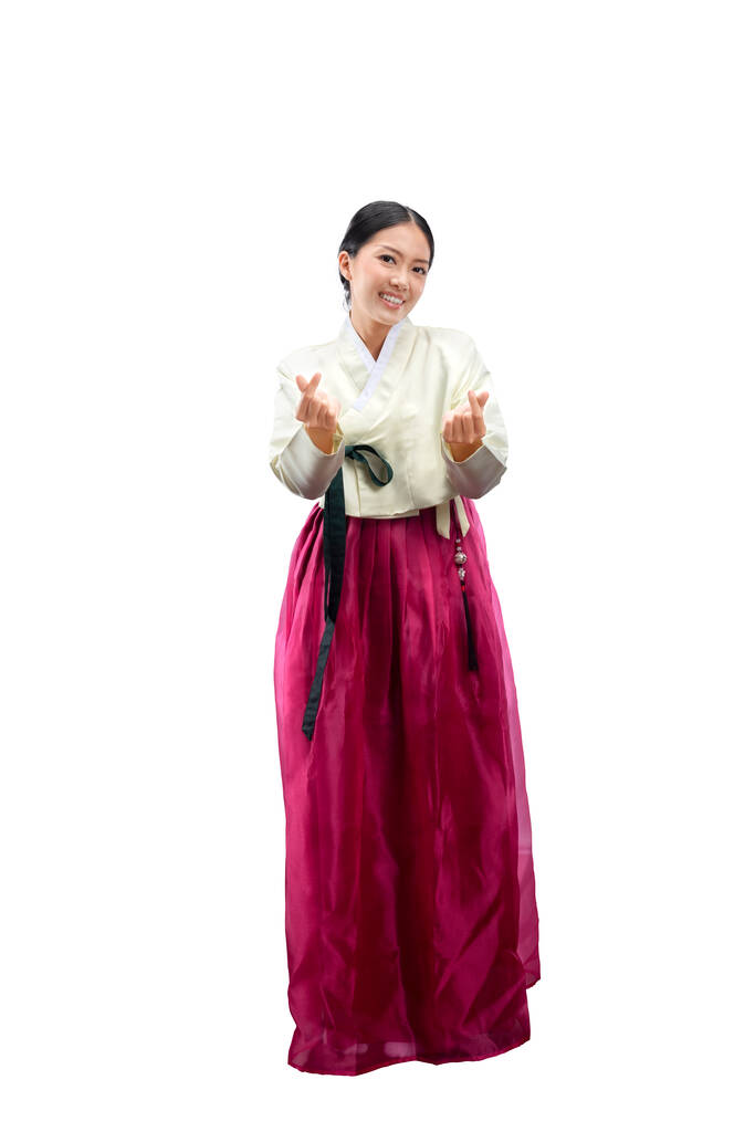 Aasialainen nainen yllään perinteinen Korean kansallispuku, Hanbok, seisoo eristetty valkoisella taustalla - Valokuva, kuva