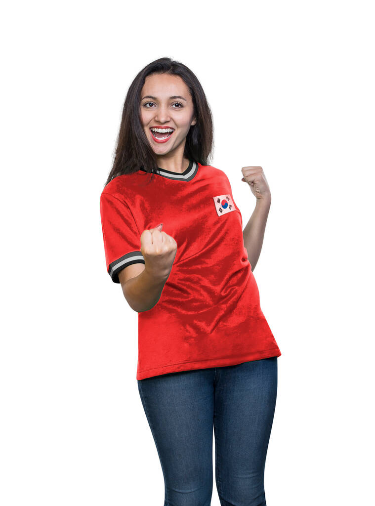 Jovem fã bonito em uma camiseta vermelha da equipe nacional da República da Coreia comemorando um gol feliz e animado no fundo branco. - Foto, Imagem