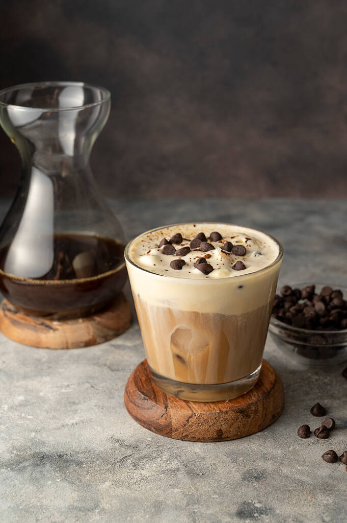 Coffee and vanilla ice crem with chocolate , coffee beans in glass cup, copy space. Lisestyle iced coffee drink - 写真・画像