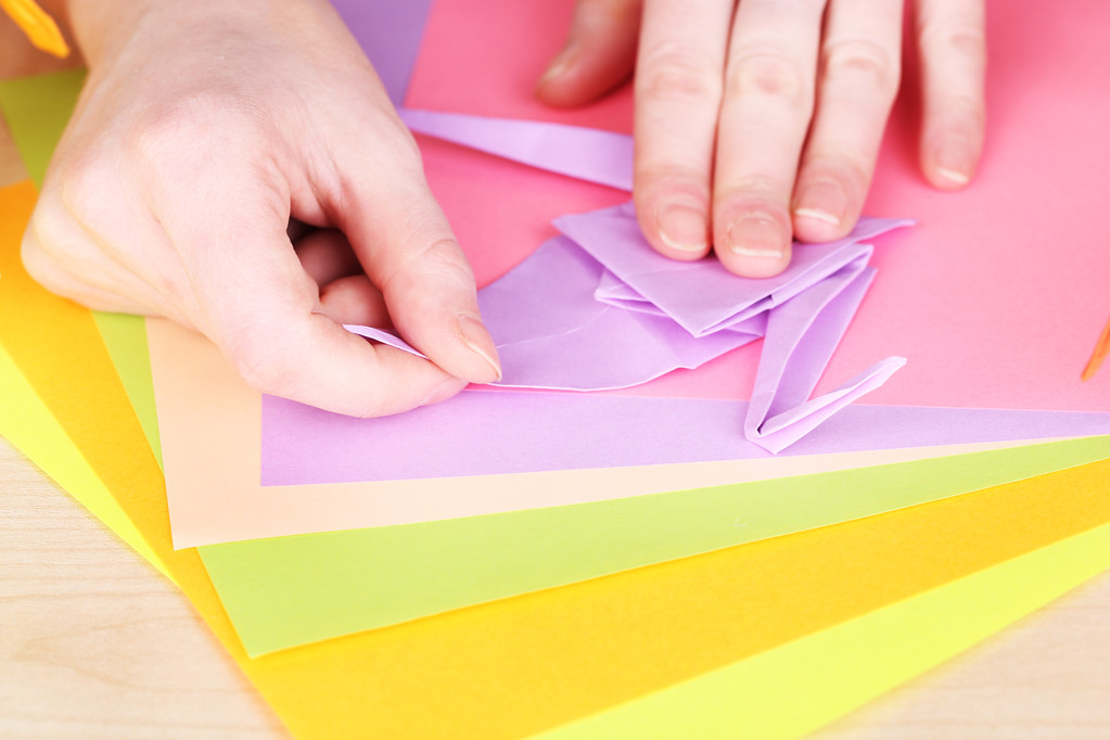 Hands making origami crane - Photo, Image