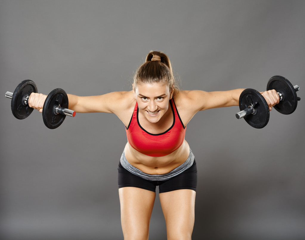 Chica de fitness trabajando con pesas
 - Foto, Imagen
