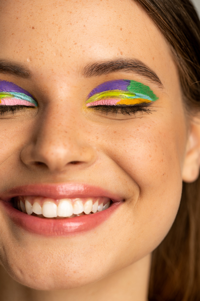 Cropped view of freckled teenage girl with colorful makeup  - Fotoğraf, Görsel