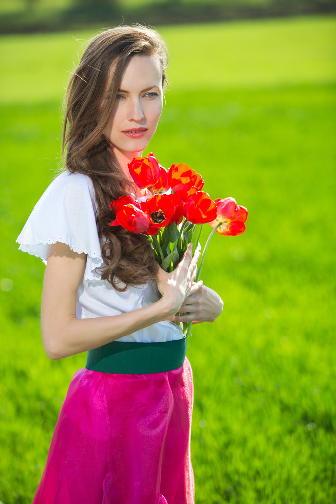 Woman with spring flowers - Photo, Image