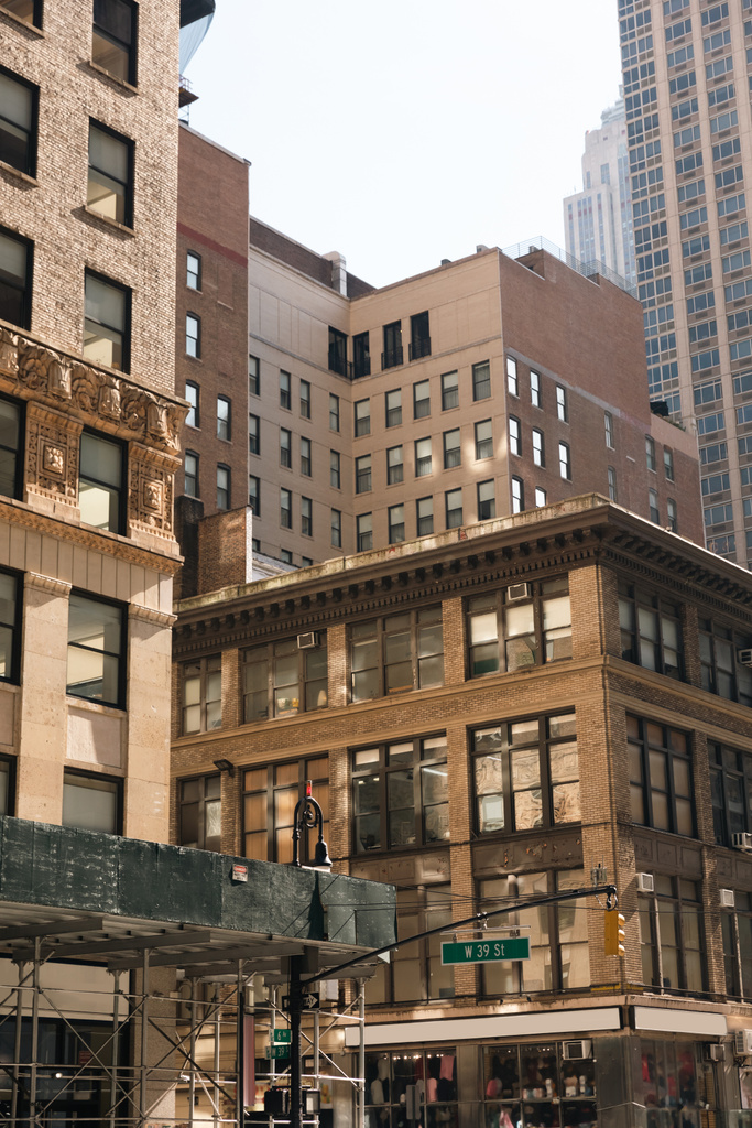 different stone and concrete buildings on urban street in New York City - Foto, Imagen