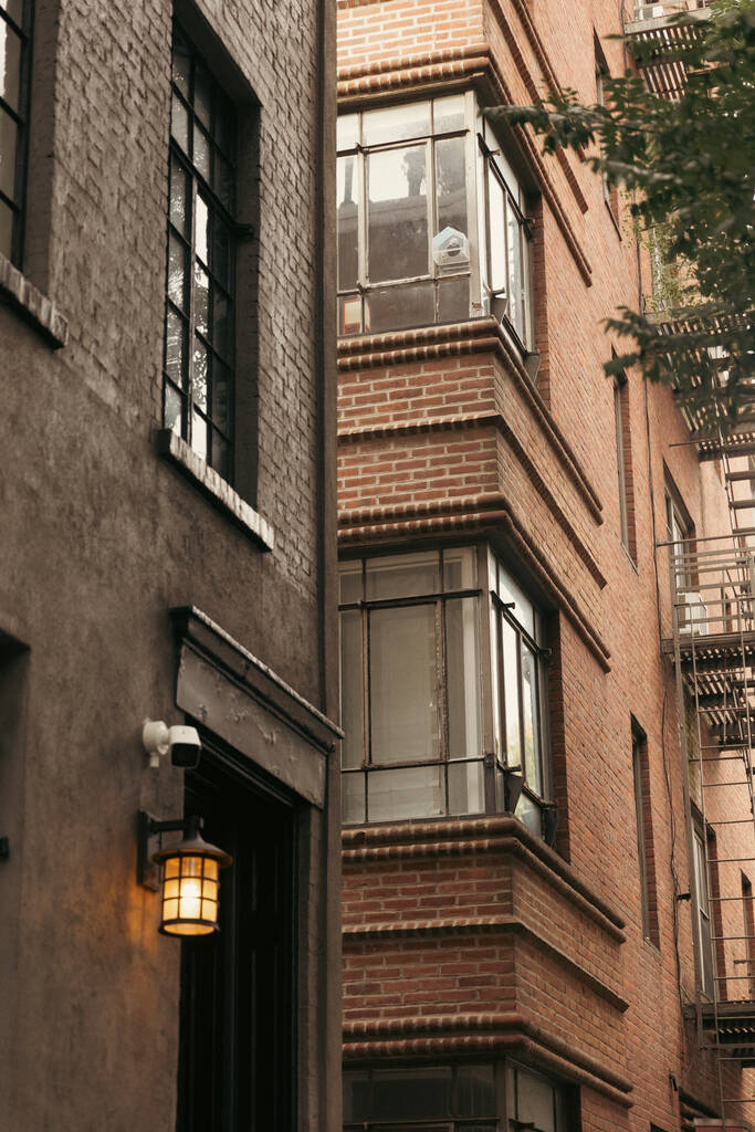 stone buildings with glazed balconies and lantern on New York City street - Φωτογραφία, εικόνα