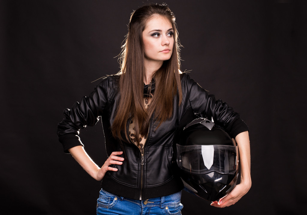 バイクのヘルメットを持つ女性 - 写真・画像