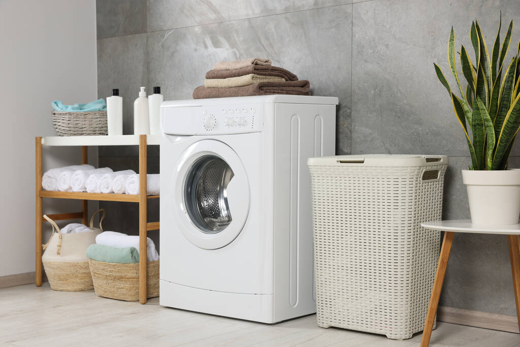 Many soft terry towels and washing machine in bathroom - Foto, Imagem