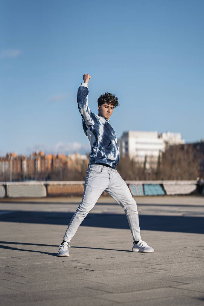 Stock photo of cool boy doing dance moves and having fun. - Foto, afbeelding