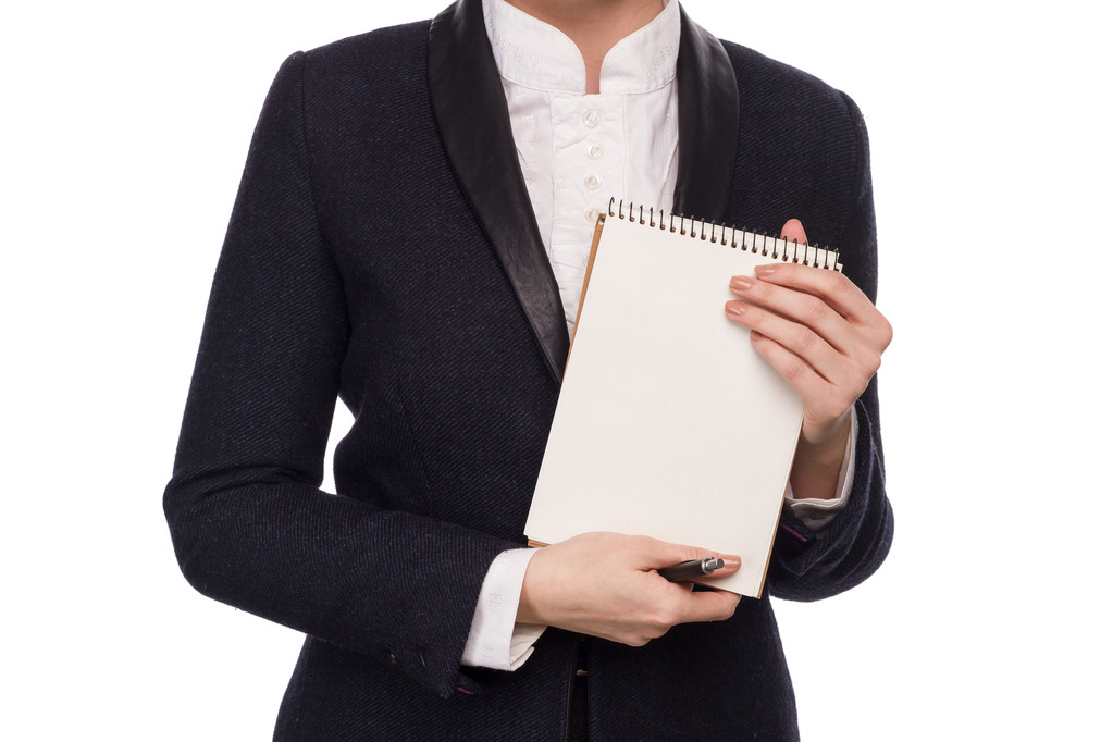 Mãos em um terno de negócios segurando uma caneta e caderno
 - Foto, Imagem