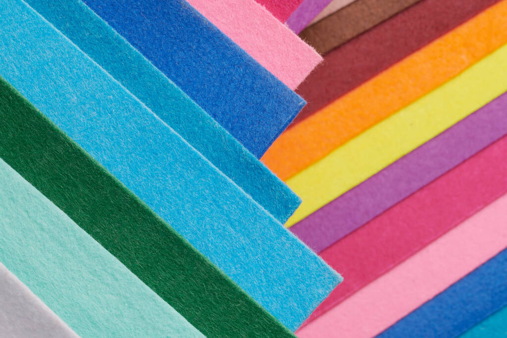 Multi-colored soft felt textile material, colorful patchwork texture fabric close-up - Foto, immagini